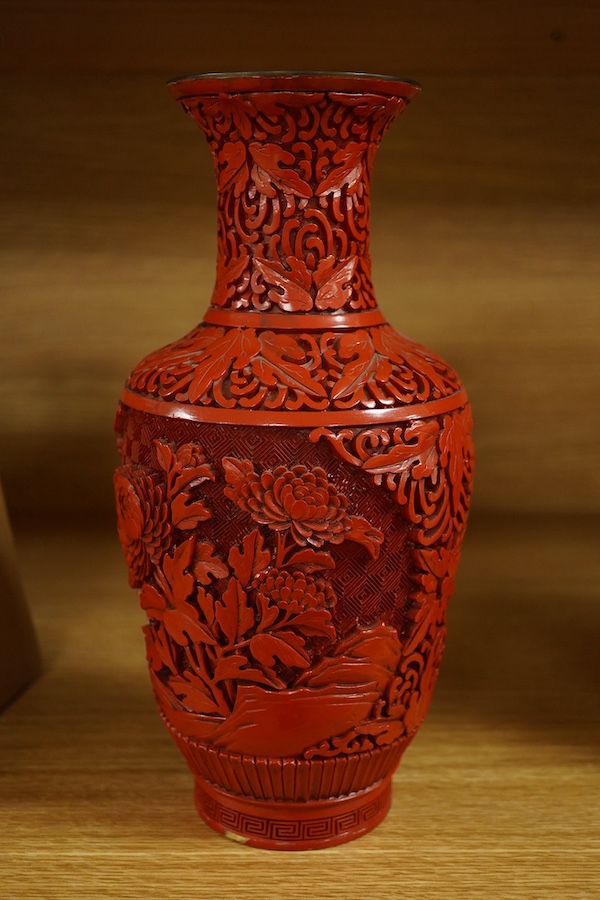 A Chinese red lacquered vase, 25.5cm. Condition - good